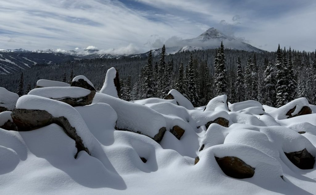 A snowy field far on the mountain step of Lone Peak, MT.